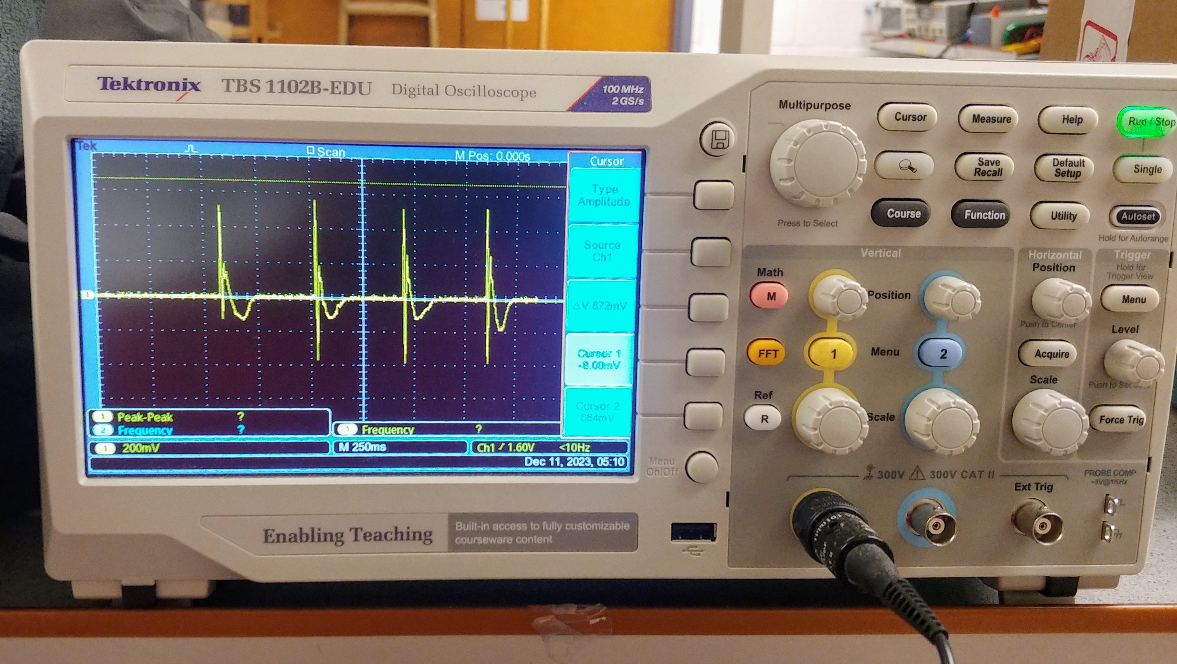 Oscilloscope reading of four drum hits, showing consistent voltage spike
